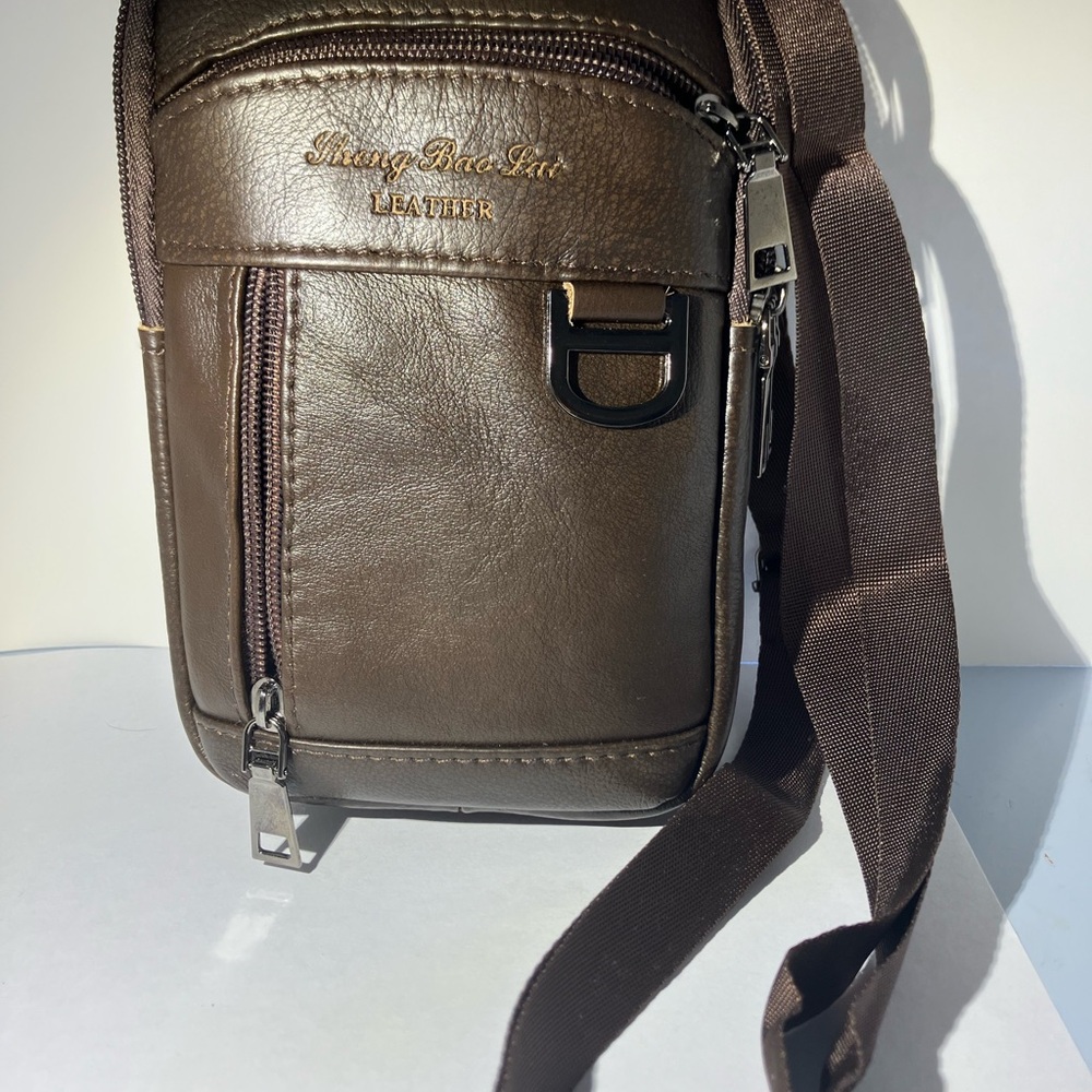 Brand New Pebbled Brown Leather Crossbody. Four zippered components
